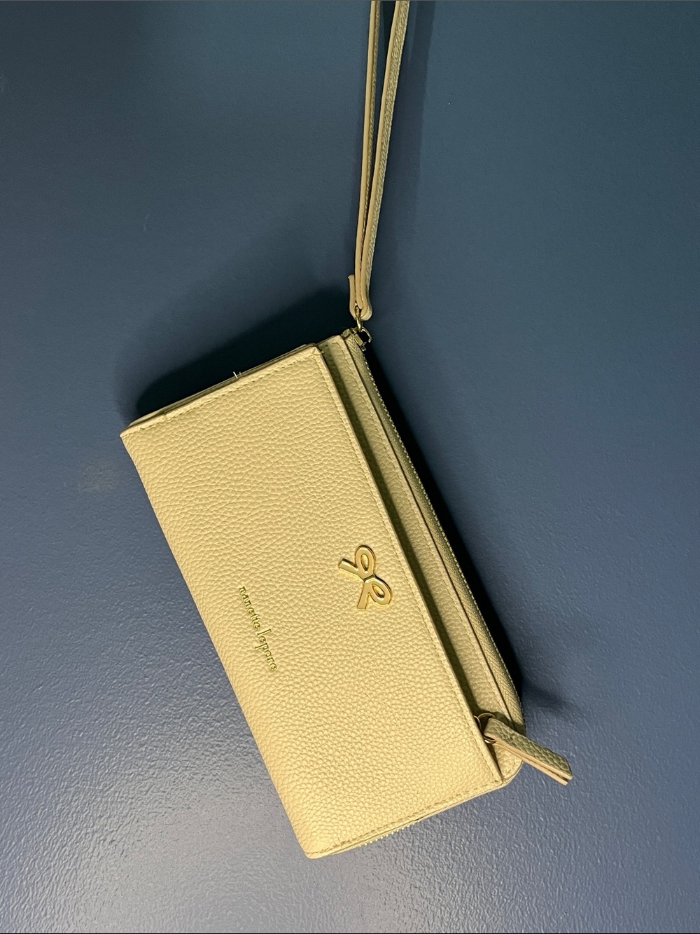 Nanette Lepore Ivory/cream pebble vegan leather wristlet w gold bow & zip NWOT